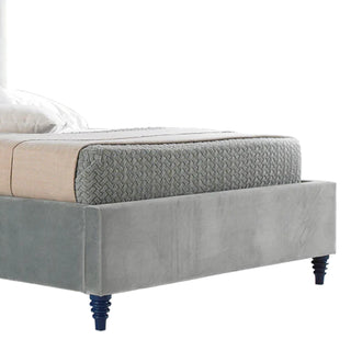 Bed with velvet upholstered headboard