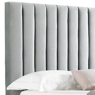 Bed with velvet upholstered headboard