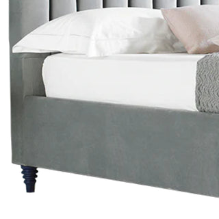 Bed with velvet upholstered headboard